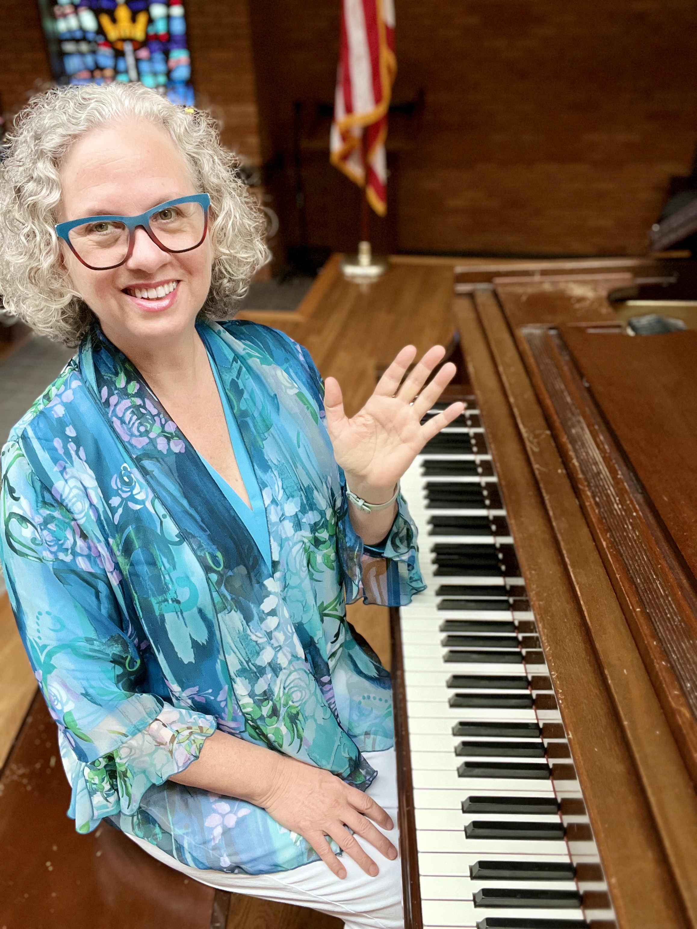 author, poet, musician, podcast host, course creator Jenny Leigh Hodgins at the piano.