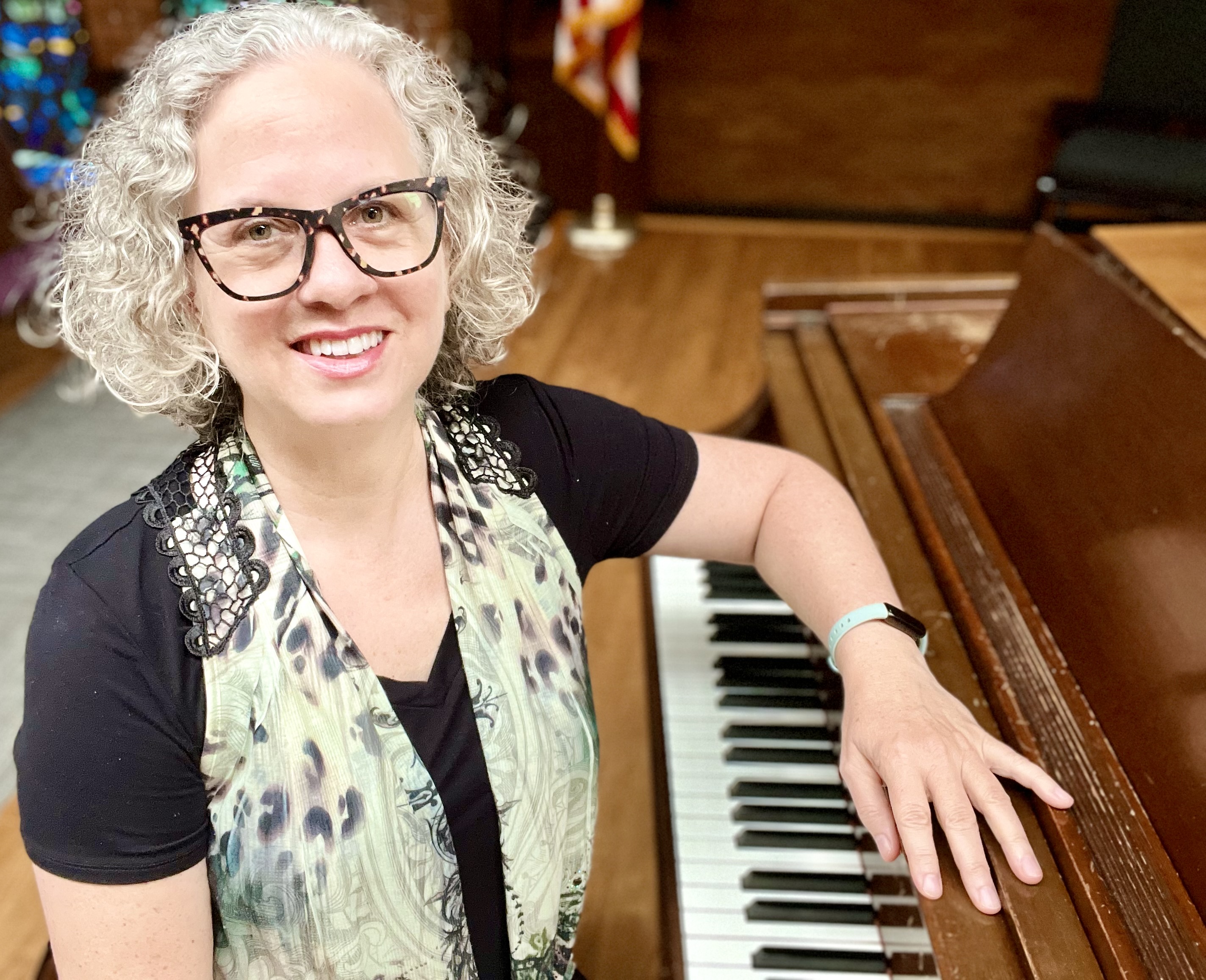 author, poet, musician, podcast host, course creator Jenny Leigh Hodgins at the piano.