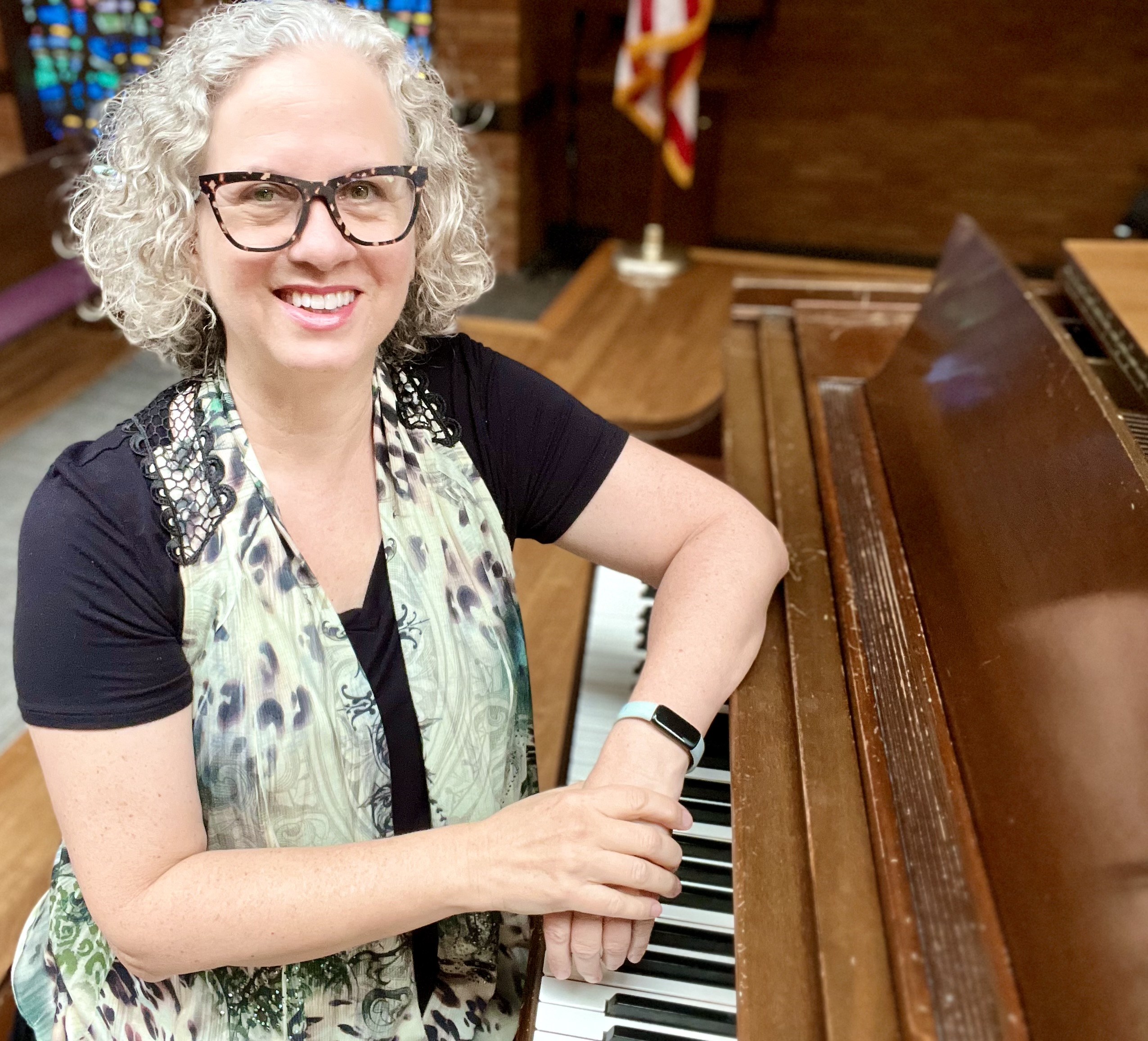 author, educator, poet, musician, composer, podcast host, course creator, creative empowerment coach Jenny Leigh Hodgins at the piano.